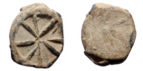 PB Roman tessera (1st-3rd centuries AD).
Obv: Wheel with eight spokes.
Rev: Blank.
Unpublished.
Weight: 2.13 g.
Diameter: 13mm.