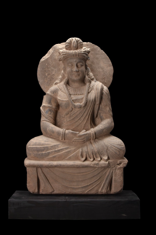 GANDHARAN SCHIST SEATED BODHISATTVA MAITREYA
Ca. 200 AD. 
A seated figure of B...