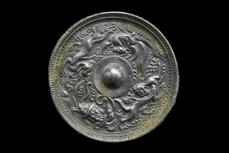 CHINESE TANG DYNASTY BRONZE MIRROR WITH FOUR ANIMALS
Ca. 618-907 AD. 
A beauti...