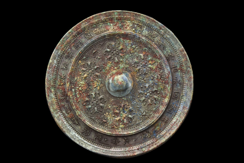 CHINESE TANG DYNASTY BRONZE MIRROR
Ca. 618-907 AD. 
A bronze circular-shaped m...