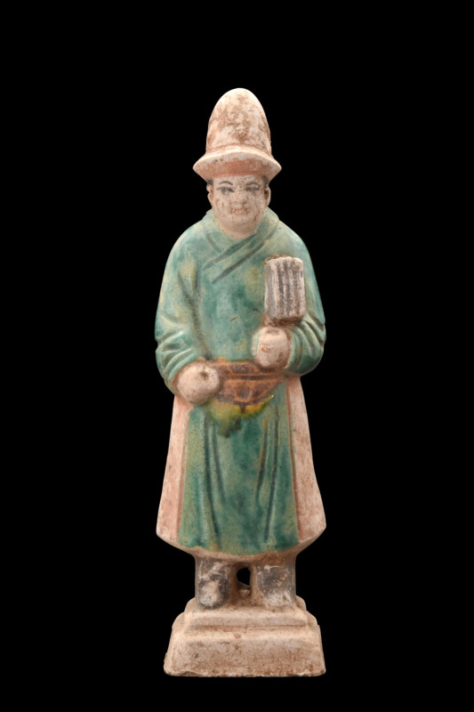 CHINESE MING DYNASTY GLAZED TERRACOTTA ATTENDANT
Ca. 1368-1644 AD or later . 
...