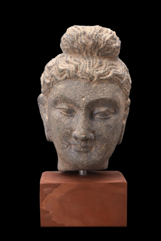 GANDHARAN SCHIST HEAD OF BUDDHA
Ca. 200-400 AD. 
A schist head of Buddha, with...