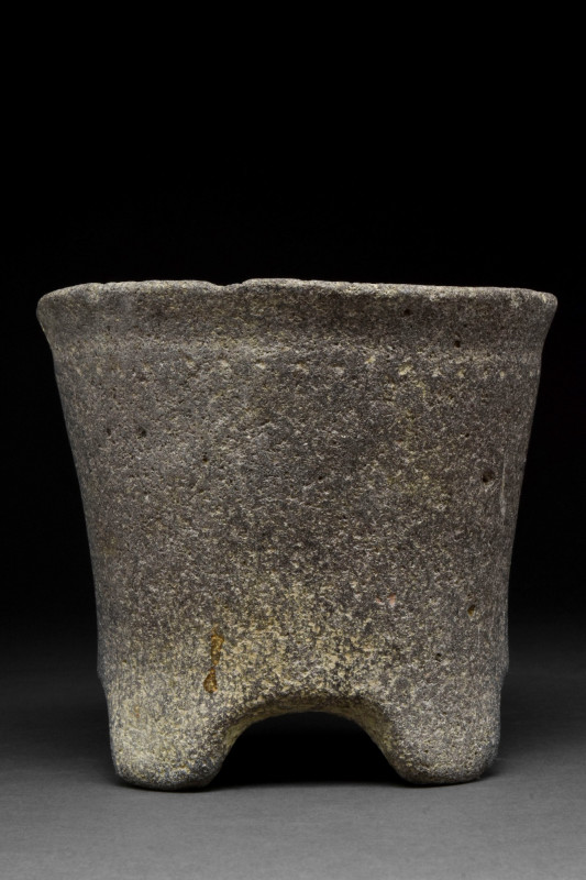 RARE EARLY BRONZE AGE TRANS-JORDAN BASALT VESSEL
Ca. 3000 BC. 
A basalt vessel...