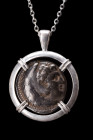 ALEXANDER III SILVER TETRADRACHM IN SILVER PENDANT

Hellenistic Period, ca. 295–275 BC. 
A silver coin (tetradrachm) of Alexander the Great within ...