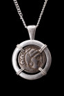 ALEXANDER III SILVER DRACHM IN SILVER PENDANT

Hellenistic Period, ca. 295–275 BC. 
A silver coin / drachm of Alexander the Great within a modern h...