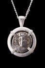 LARISSA SILVER DRACHM IN SILVER PENDANT

Thessaly, ca. 400-370 BC. 
A silver coin / drachm within a modern handmade circular sterling silver settin...