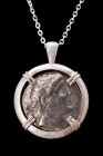ANTIOCHUS I SOTER TETRADRACHM IN SILVER PENDANT

Seleukia on the Tigris, ca. 281-261 BC. 
A silver coin / tertradrachm within a modern handmade cir...