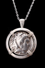 ALEXANDER III SILVER TETRADRACHM IN SILVER PENDANT

Hellenistic Period, ca. 295–275 BC. 
A silver coin (tetradrachm) of Alexander the Great within ...