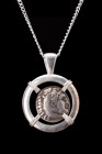 ALEXANDER III SILVER DRACHM IN SILVER PENDANT

Hellenistic Period, ca. 295–275 BC. 
A silver coin / drachm of Alexander the Great within a modern h...