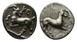 CILICIA. Kelenderis. Obol (3rd century BC). (0.8 Gr. 13mm.)
KE. Goat kneeling left, head right.
Rev. Horse prancing right.
