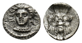 Cilicia, Uncertain mint. Silver Obol, 4th century BC. ( 0.8Gr. 14mm)
Female head (Arethusa?) facing slightly left. 
Rev. Facing head of Bes.