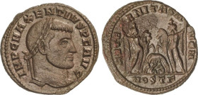 Follis. 306-312 d.C. MAJENCIO. OSTIA. Rev.: AETERNITAS AVGN. Dioscuros de frente sujetando los caballos, loba y gemelos entre ellos. En exergo: MOST. ...
