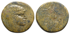 Paphlagonia, Sinope, c. 85-65 BC. Æ (28mm, 18.43g, 12h). Helmeted head of Athena r. R/ Perseus standing, holding harpa and head of Medusa; at feet, bo...