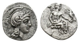 CILICIA. Uncertain. (4th century BC). AR Obol.
Obv: Helmeted head of Athena right.
Rev: Baaltars seated right on throne, holding eagle and lotus-tippe...