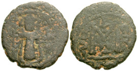 "Arab-Byzantine. Standing imperial figure type. AD 680s-ca. AD 693. AE follis (19.8 mm, 3.33 g, 11 h). Damascus mint. Crowned and robed figure standin...