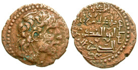 "Artuqids of Mardin. Najim al-Din Alpi. AH 547-572/AD 1152-1176. AE dirhem (30 mm, 12.90 g, 10 h). Diademed, Seleukid-style bust right, with the name ...