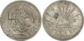 World Coins
8 Reales. 1877. MÉXICO. M.H. 26,83 grs. AR. Pequeños resellos. (Golpecitos en canto). ESCASA. KM-377.10. MBC+.