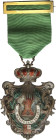 Spanish Decorations
Al Mérito en el Seguro. Medalla de plata 2ª clase. (1939-1975). AR, AE y esmalte al fuego. Ø 74x51 mm. Con corona articulada, ani...