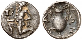 COINS OF THE GREEK WORLD. THRACE. Thasos. Trihemiobol c. 411-340 BC. Bald satyr kneeling to left, holding kantharos in his right hand and resting his ...