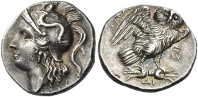 Calabria, Tarentum. 
Drachm circa 281-270, AR 3.27 g. Head of Athena l.; wearing Attic helmet decorated with Scylla hurling a stone. Rev. ΤΑΡΑ[ΝΤΙΝΩΝ...