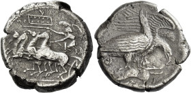 Sicily, Agrigentum. 
Tetradrachm circa 410-406, AR 17.39 g. Prancing quadriga driven l. by Nike holding kentron and reins; beneath the further horse ...