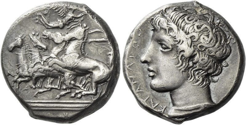 Catana. 
Tetradrachm circa 405, AR 17.07 g. Fast quadriga driven l. by chariote...