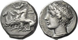 Catana. 
Tetradrachm circa 405, AR 17.07 g. Fast quadriga driven l. by charioteer, holding reins in both hands; above, Nike flying r. to crown him. I...