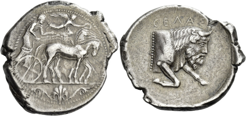 Gela.
Tetradrachm circa 450-440, AR 17.00 g. Slow quadriga driven r. by chariot...