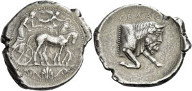Gela.
Tetradrachm circa 450-440, AR 17.00 g. Slow quadriga driven r. by charioteer, holding reins and kentron; in field above, Nike flying r. to crow...