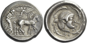 Syracuse. 
Tetradrachm circa 485-480, AR 17.29 g. Slow quadriga driven r. by charioteer, holding kentron and reins; above, Nike flying r. to crown ho...