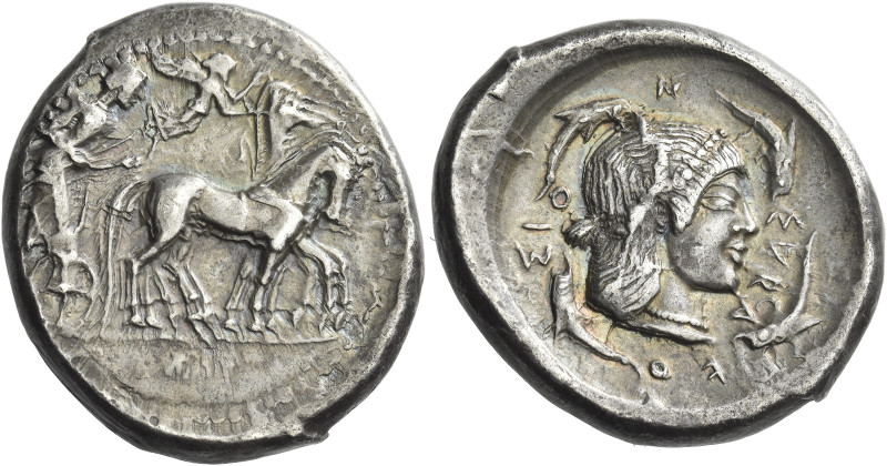 Syracuse. 
Tetradrachm circa 480-478, AR 17.40 g. Slow quadriga driven r. by ch...