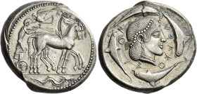 Syracuse. 
Tetradrachm circa 465-460, AR 17.25g. Slow quadriga driven r. by charioteer holding reins and kentron; in field above, Nike flying l. to c...