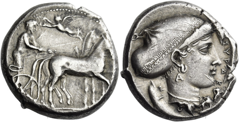 Syracuse. 
Tetradrachm circa 420, AR 17.23 g. Slow quadriga driven r. by chario...