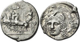 Syracuse. 
Tetradrachm signed by Eukleidas circa 413-399, AR 17.28 g. Fast quadriga driven l. by female charioteer, holding reins in l. hand and rais...