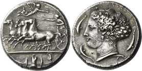Syracuse. 
Decadrachm signed by Kimon circa 405-400, AR 43.21 g. Fast quadriga driven l. by charioteer, holding reins and kentron; in field above, Ni...