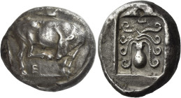 Eretria. 
Tetradrachm circa 510, AR 17.12 g. Bull standing r., scratching nose with its hind hoof; bird standing r. on bull's back; below, E. Rev. Oc...