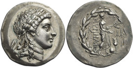 Myrina. 
Tetradrachm circa 165-160, AR 16.61 g. Laureate head of Apollo r. Rev. MYPINAIΩN Apollo Grynios standing r., holding branch and phiale; at h...
