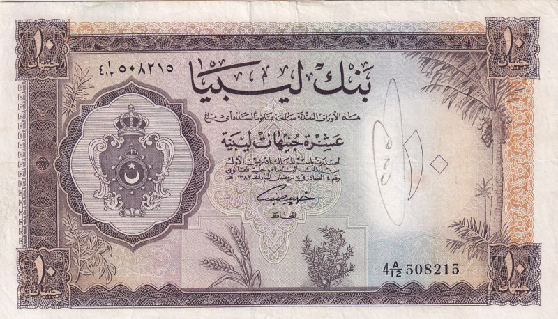 Libya, 10 Pounds, 1963, VF, p27
Has a pencil writing, There are stains and spli...