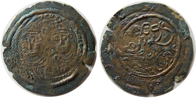 ARAB-BYZANTINE, Late 7th. century. Æ (0.84 gm; 24 mm). Obverse, two Imperial Byz...