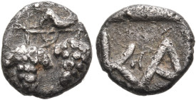 ARKADIA. Kaphyai. Circa 460 BC. Hemiobol (Silver, 8 mm, 0.48 g, 3 h). Two bunches of grapes on a branch on which a dove (?) stands to left. Rev. Κ Α w...