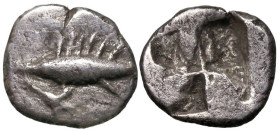 Greek
MYSIA. Kyzikos. (Circa 600-550 BC)
AR Obol (8.3mm 0.54g)
Obv: Tunny fish to left, holding stem of lotus flower in its mouth; flower head belo...