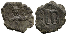 World
Arab-Byzantine, Umayyad Caliphate. Uncertain mint (647-670 AD). Pseudo-Byzantine type, imitating the types of Constans II.
AE Fals (22.3mm 5.2...