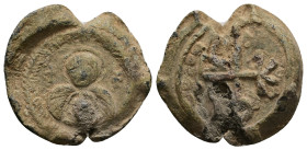PB Byzantine lead seal (AD 6th–7th centuries)
Obv: Between two crosses, a bust of the Mother of God holding the Child before her. Wreath border.
Rev...