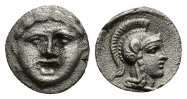 Pisidia, Selge. Ca. 350-300 B.C. AR obol (0.8 Gr. 10mm.) 
 Facing gorgoneion 
Rev. Helmeted head of Athena right; behind, astralagos.