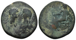 CARIA, Aphrodisias. Domitian, with Domitia. AD 81-96. Æ (26mm, 13.0 g). Confronted busts of Domitian, laureate, and Domitia, draped / Tyche of Aphrodi...
