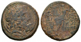 Imperio Seleucida. AE 26 . 300 a.C. Antioquía. (Se-5843 variante). Anv.: Cabeza de Zeus. Rev.: Zeus entronizado a izquierda con Victoria. Ae. 11,40 g....
