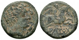 Iltirta. As. 220-200 a.C. Lleida (Cataluña). (Abh-1465). Anv.: Cabeza masculina a derecha rodeada de tres delfines. Rev.: Jinete a derecha con palma y...