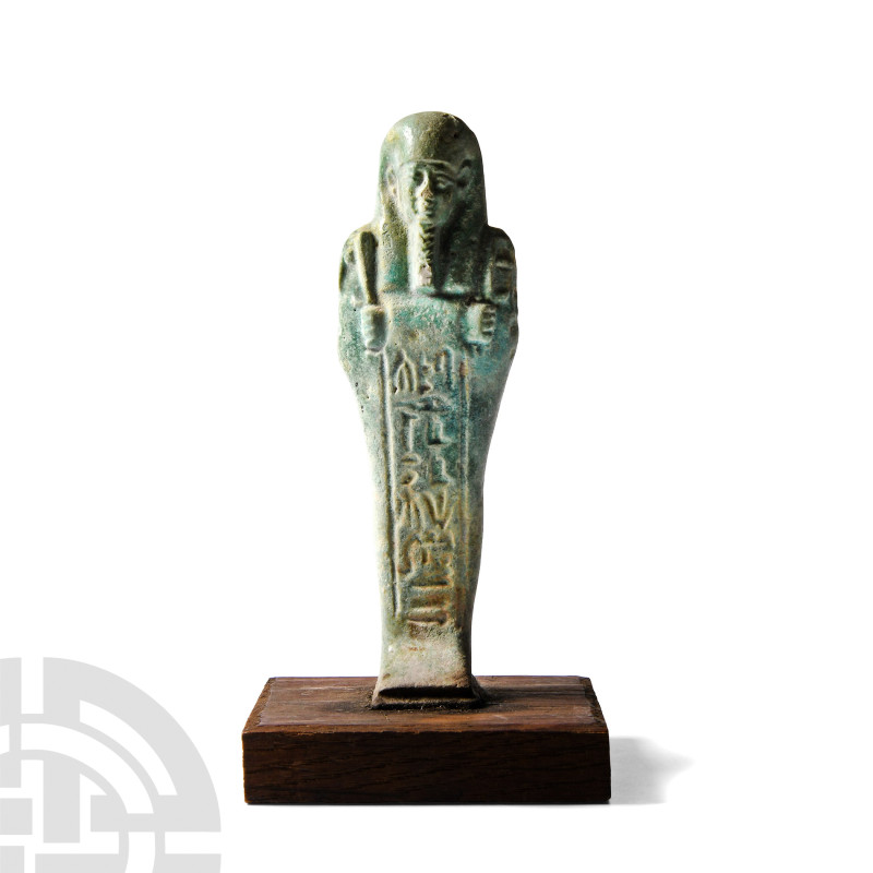 Egyptian Green Glazed Hieroglyphic Shabti
Late Period, 664-323 B.C. Modelled mu...