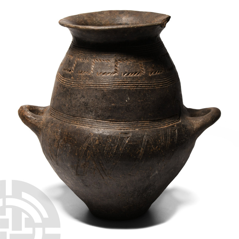 Villanovan Impasto Biconical Urn
Circa 8th century B.C. Black burnished ceramic...