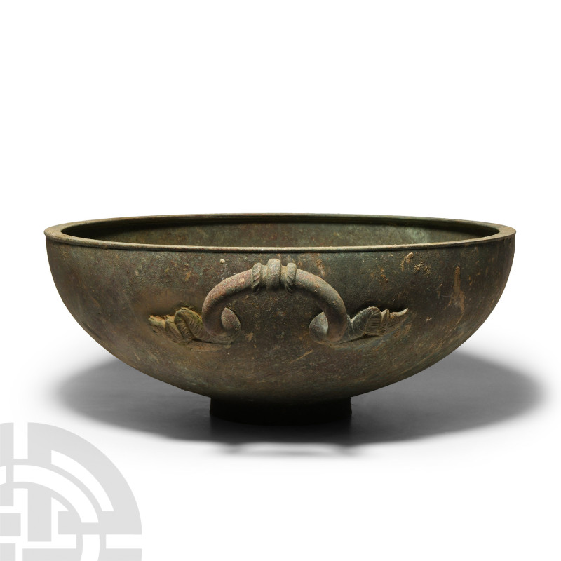 Large Roman Bronze Bowl with Handle
5th-6th century A.D. Broad squat vessel wit...